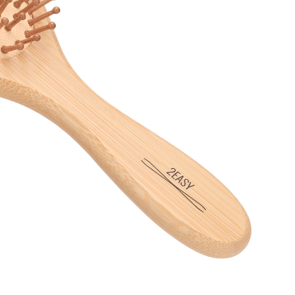air cushion wooden hairbrush handle closeup