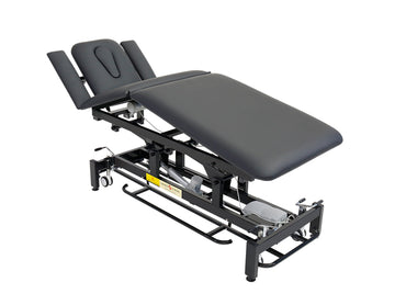 Electric spa bed with adjustable backrest, leg-rest, and wide cushion. Adjusted height look.