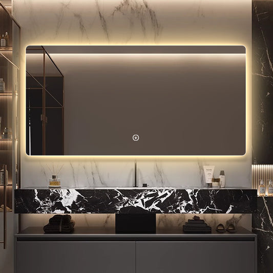 Frameless rectangular backlit LED bathroom mirror.