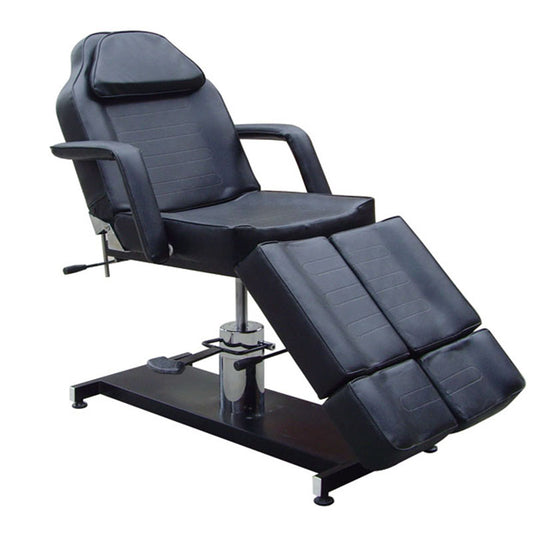 Hydraulic tattoo chair with adjustable positioning for artists and clients. Center view.