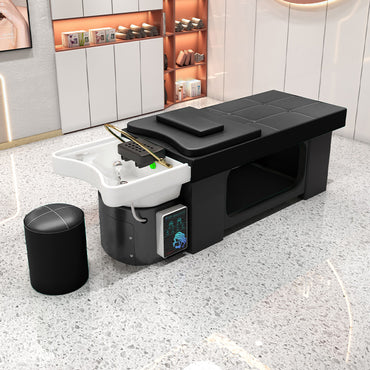 All-in-one shampoo and massage treatment bed for salon use.