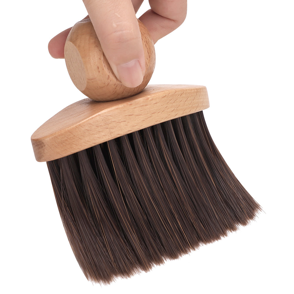 beechwood hair sweep brush being held closeup