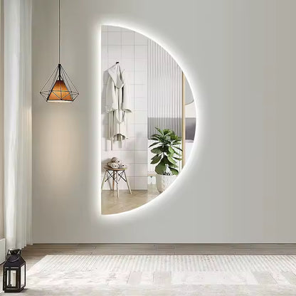 Half moon LED wall mirror with soft lighting and modern design.