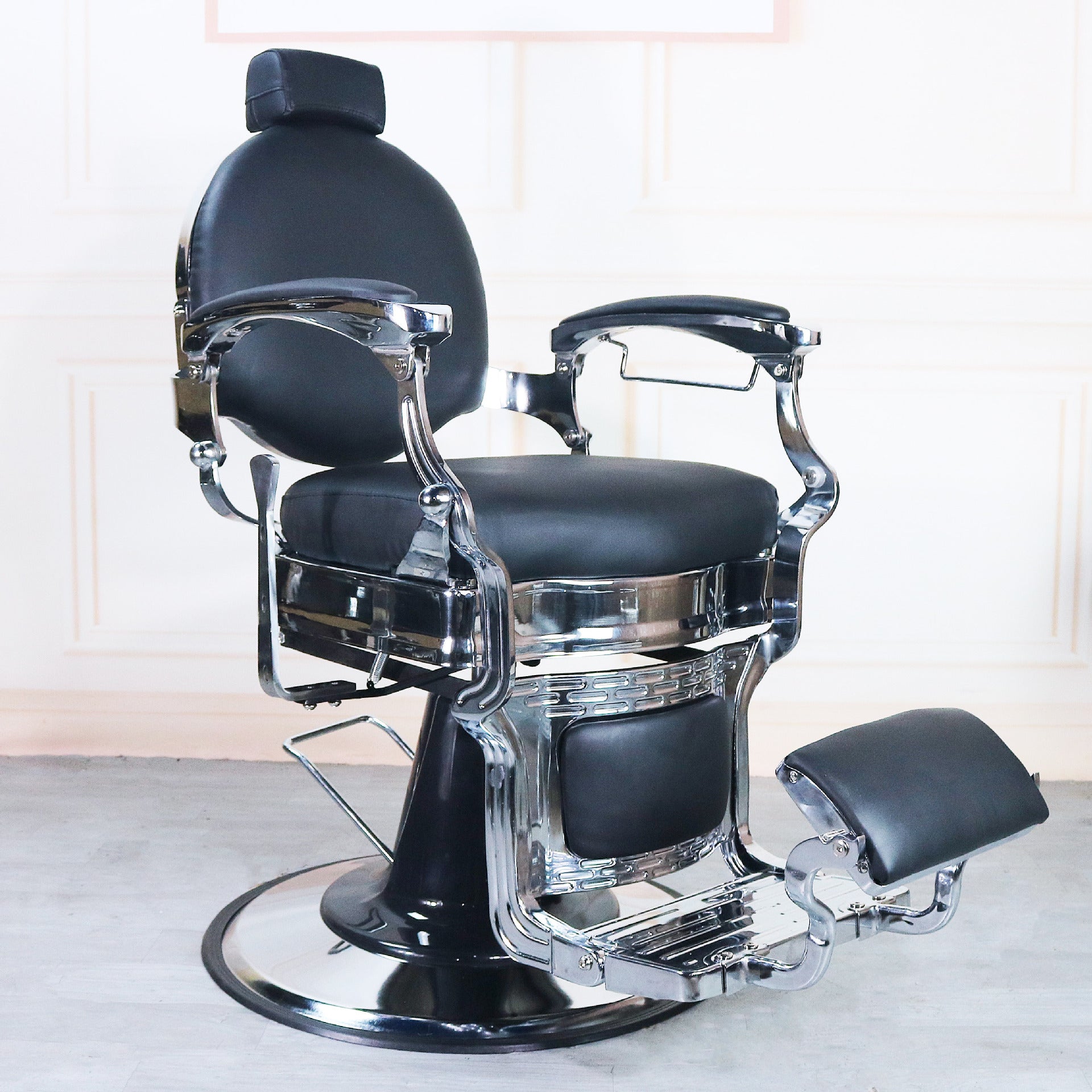 Barber chair with adjustable recline and 360-degree rotation. Center view.