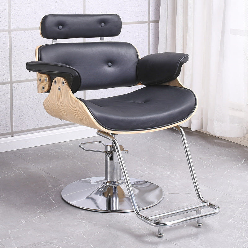 salon styling chair with 360° swivel and hydraulic lift. Center view.
