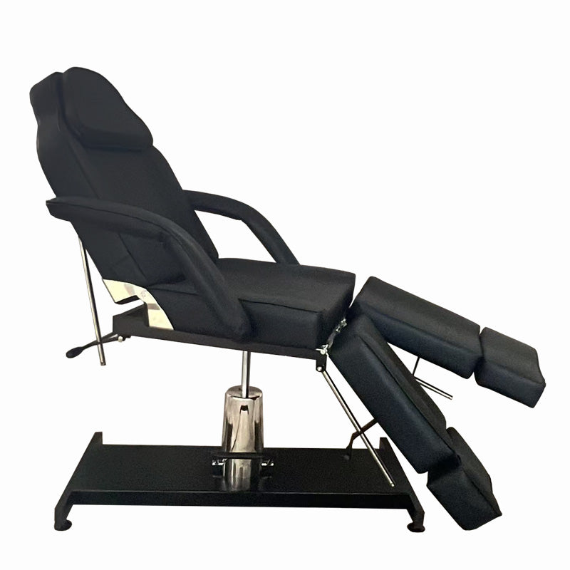 Hydraulic tattoo chair with adjustable positioning for artists and clients. Side view.