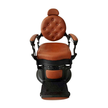 Vintage-style barber chair with button-tufted backrest and brown PVC leather. Front view.